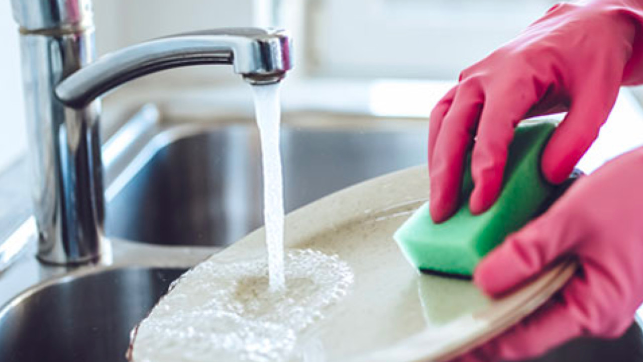 Person cleaning up the dishes