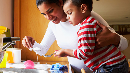 Mother and child doing the dishes together